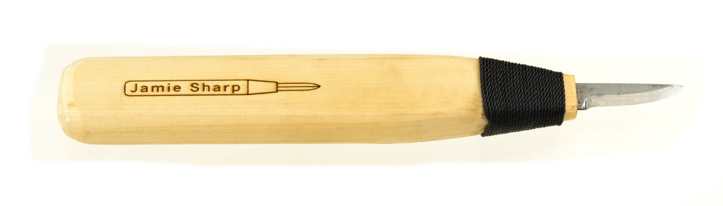 A traditional northwest coast style straight back wood carving knife with a double bevel blade, approximately 1.5 inches long
